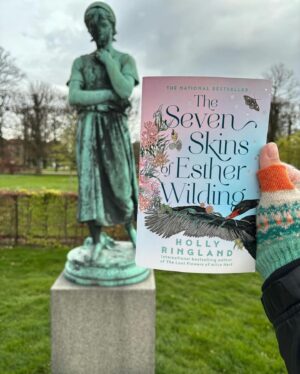 Holly Ringland Instagram - In 2014 when I stood spellbound in Copenhagen in front of the sculpture of Liden Gunver, I remember taking photos of her and thinking as goosebumps went through me, remember her, she means something to you, you just don’t know it yet. It was my first time in Denmark, country of my ancestors, and we were there from Manchester for just a long weekend, a surprise trip from Sam. At the time I was bereaved and felt like a mess; funny how in the depths of that kind of grief we can be wide open for the inexplicable to find us. 8 years later, Liden Gunver became an elemental part of Esther Wilding and her sister Aura Wilding’s stories in my second novel. Now, ten years later, seeing this post from @bookishbron is a kind of wonder I don’t have words to name. Thank you Bron, for blowing my mind and sharing this magic. Maybe she chose the depths, maybe she’s free.
🩵🌸🐦‍⬛
Repost • @bookishbron I started The Seven Skins of Esther Wilding (by @hollygoeslightly) on our flight from Australia to Denmark, and read it as we travelled around the country and back to Copenhagen. I honestly couldn’t have had a better travelling companion than Esther. This was one of those books that I felt in my bones and my heart and my soul. Copenhagen, and later the Faroe Islands felt like characters in the book and I just loved that. I’ve spent a little bit of time living in Denmark in the past, and Esther’s experience of arriving into the place and culture really moved me. A lot about the book moved me to be honest - I was nearly sobbing on the bus reading one part in particular that left me feeling like my chest had been broken open.
This little statue in the photo, Liden Gunver, plays an important part in Esther’s story. She stands outside Rosenborg Castle in Copenhagen, and I couldn’t visit without taking Esther with me! Swipe to see the page from the book featuring Liden Gunver (spoiler-free!)
I might have more to say about this book later, but for now I’m just sitting with the feelings it has left me - it’s one I know will be in my heart for a long time ❤️🇩🇰
*
#BookishBron #EstherWilding #HollyRingland #TheSevenSkinsOfEstherWilding #AusLit #LidenGunver #VisitCopenhagen #RosenborgCastle