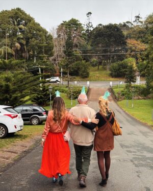 Holly Ringland Instagram - In December 2019 Sam   I left our house in Manchester, UK, to spend what was meant to be a couple of months at home in Australia. Then, of course, 2020 happened... and 2021, 2022, 2023... We’ve not yet returned. We’ve been living with my folks through it all. I’ve written more books   worked as an author for longer in their house than my own. While us all living together was obviously unexpected, I am keenly aware, every day, that these have been   are the most precious family years of my adult life. I couldn’t have written   toured 2 books, filmed Back to Nature, experienced Alice Hart take life on screen, or shown up in my work   life in the same way that I have for the past 5 years without their glorious, bananas, beautiful, ferocious support.
All of my birthdays in my 40s have been spent with them. We’ve made new birthday traditions: party hats at lunch   self timer photos. These photos are the latest from our birthday files. I turned 44 yesterday. Our toast made me weep with joy   gratitude to be living   sharing life with them. To reflect together on the last year   look ahead to what’s coming: a new year of creativity   new book, and, very soon, a new form of writing for me.
The Joy Rise is my wholly-reader-supported online community space, which includes a monthly newsletter - at the heart of which is creativity and connection. I’m writing it for anyone who’s ever felt their artistic courage flattened by fear. The first issue is nearly here, which I’ve written on Yugambeh Country, around walks with Sam, cups of tea with mum in the garden, my stepdad in the shed, our dogs at my feet. If my newsletter could include a soundtrack, you’d hear my folks mowing, the pups snoring, southeasterlies in the gum trees   mum’s trowel making space in the soil for seeds.
That’s what I hope The Joy Rise can offer you: space for new beginnings in your creativity and a season to bloom.
Link in bio to subscribe.
Love,
Holly