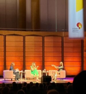 Holly Ringland Instagram - A couple of weeks ago I was in Sydney trying to calm my nerves: I was on my way to the biggest event of my writing career. As I got into my taxi, I recalled something Sam had said to me earlier: “don’t forget to give yourself a moment to take this in.” When I found that moment en route, I also found 14 year old me, clacking away on my secondhand IBM, writing my heart out. Funny how quickly our younger selves can bring sense and courage to a moment: I kept that nerdy, emotionally-porous kid close to me as I stood in the wings of Sydney’s City Recital Hall with @juliabaird and @michaelakalowski - two women I greatly admire. I kept that kid close as my heart pounded while we walked onto the stage and took our seats. For the next hour in that stunning venue we talked about creativity, joy and grace in front of a warm, generous crowd. I was humbled when Michaela asked me to speak about one of my favourite sections from The House That Joy Built: creativity is the light we leave on inside of ourselves, no matter how long we’ve resisted or neglected our own homecoming. Always shining, no matter how dim. Always waiting, for us to return. (At that point, in my mind’s eye, 14 year old me turned at her keyboard and gave me a nod of approval.)

Heartfelt thanks to Michaela, Julia and everyone who joined us. To readers who waited patiently in the signing line. To @sydwritersfest for inviting me to be a part of something so special. To the festival volunteers, staff and booksellers who made the magic happen. To Will and Theresa, ASL interpreters. And special shout out to the sound crew who played us off stage to my beloved Pearl Jam.

To allow ourselves to feel joy and to choose grace is often difficult. To embody either/both is the best of who we are and what we have to offer each other. In the words of poet Ross Gay, from The Book of Delights: “What if we joined our sorrows, l’m saying. I’m saying: What if that is joy?” This event was a powerful reminder of how important it is to share stories of imagination, humanity and courage. It was a career highlight, honour and privilege. I am so grateful to have been a part of it.