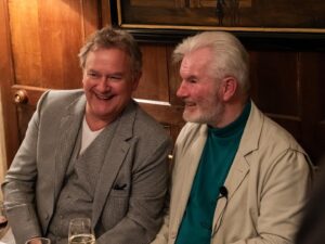 Hugh Bonneville Instagram - It was a real honour to interview Guy Deacon about his odyssey across Africa with Parkinson’s - raising awareness about this cruel disease. A stubborn, witty, inspiring man. Please read his book, Running on Empty. All proceeds go to The Deacon Foundation, @cureparkinsons and @parkinsonsafrica.

Photo 1: With Guy and his wife Tania, @tdhikingadventures.

2: With Guy and the VW van he drove across Africa, raising awareness for Parkinson’s Disease, from which he suffers.

3: With Guy and film director @robhayward_ just before the gig, whose documentary (to be broadcast on Channel4) charts Guy’s remarkable journey.

4-6: 📸 Jack Gaunt

The stunning setting for our conversation was @northcadburycourt - huge thanks to Janet Montgomery for hosting the event.