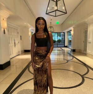 Iyana Halley Instagram - Dipped in GOLD🍯
@FashionNova -Shining Star Sequin Maxi Skirt-