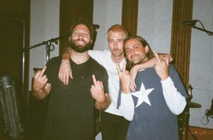 Jai Courtney Instagram - SKIRT ALERT! my brothers @nicky.plz @gradystrange.mp3   I made some loud trashy shit and the EP finally dropped today! we proud af. give it a spin while you contemplate the world’s end. much love and gratitude to @stationhousestudio . crazy times. rock n roll will heal your soul 🖤 
lynx in bio