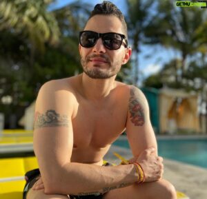 Jake Graf Instagram - This week 4 years ago, Jake and I were on our Babymoon in Miami, enjoying a brief last break together as a twosome, while we waited for our Millie to arrive.

I was very ill for the first few days, unaware of why I couldn't taste or smell anything, and we watched as the world began to shut down around us. 

Jake and I got back on one of the last flights home from the US, arriving in Ireland soon after as travel bans came in, getting to Belfast many weeks ahead of Millie's birth, but grateful to be there. 

So much has happened in 4 years, but that last week with friends in the sun, awaiting our daughter's birth before the world imploded, will always remain etched in my memory. 

#sun #miami #couple #holiday #babymoon #lgbt #trans #family