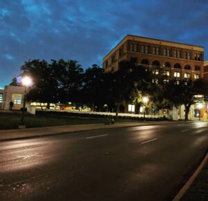 James A. Janisse Instagram - As a US President / US History fanatic, I had to see this while I was in Dallas: the X in the road (lower left, under the light) is where JFK was shot by Oswald from the building in the background (formerly the School Book Depository, now an Administration Building and Museum). Very weird to see in person (and good contextual info for @carebecc who's reading 11/22/63 right now)