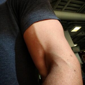 James Willems Instagram - If you have access to a #SwissBar I highly recommend looking up how to use it. Great for #triceps when you press. Huge pump in your #biceps when you pull. Plus, it's safer for your shoulders. These #feet are a big fan.