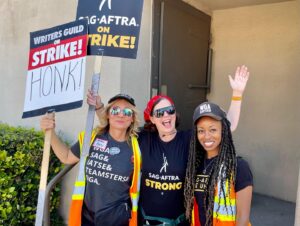 Janie Haddad Tompkins Instagram - Can’t break this SAG-AFTRA & WGA solidarity, AMPTP, even though your boy Sarandos has MADE $1.5b extra for Netflix by not shooting anything new while we want to bargain. What is he doing? Just letting subscribers PROP up that Wall Street shell game while our industry takes the punch? Move slow and make things, instead. ✊

#WGAstrong #DoTheWriteThing #WGAstrike
#SagAftraMember #1u 
#SAGAFTRAstrong #SAGAFTRAstrike #Power2Performers
#HotLaborSummer