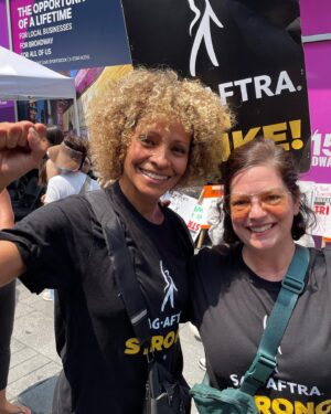 Janie Haddad Tompkins Instagram - 1) @realmichellehurd who says, “We’re on the right side of history!” Thank you, Michelle for the pic and the strong words! 2) me and Todd proving the @wgaeast & @sagaftra solidarity! 3) with signs 4) making some noise for THE SUITS 5) obsessed with this NYC strike captain, I love her energy and leadership

#WGAstrong #DoTheWriteThing #WGAstrike
#SagAftraMember #1u 
#SAGAFTRAstrong #SAGAFTRAstrike #Power2Performers