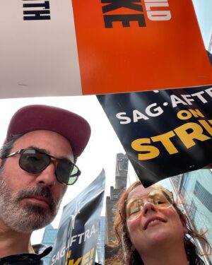 Janie Haddad Tompkins Instagram - 1) @realmichellehurd who says, “We’re on the right side of history!” Thank you, Michelle for the pic and the strong words! 2) me and Todd proving the @wgaeast & @sagaftra solidarity! 3) with signs 4) making some noise for THE SUITS 5) obsessed with this NYC strike captain, I love her energy and leadership

#WGAstrong #DoTheWriteThing #WGAstrike
#SagAftraMember #1u 
#SAGAFTRAstrong #SAGAFTRAstrike #Power2Performers