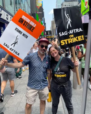 Janie Haddad Tompkins Instagram - 1) @realmichellehurd who says, “We’re on the right side of history!” Thank you, Michelle for the pic and the strong words! 2) me and Todd proving the @wgaeast & @sagaftra solidarity! 3) with signs 4) making some noise for THE SUITS 5) obsessed with this NYC strike captain, I love her energy and leadership

#WGAstrong #DoTheWriteThing #WGAstrike
#SagAftraMember #1u 
#SAGAFTRAstrong #SAGAFTRAstrike #Power2Performers