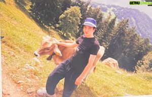 Jay Baruchel Instagram - Wearing a bucket hat with a cow in Switzerland in 1999.
