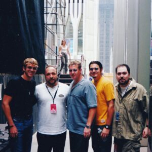 Jay DeMarcus Instagram - This picture appeared in my memories today… it was sent to me by @christianpalmer2112 who at that time, worked as a regional for Lyric Street, our record label at the time. Just behind us you can see the iconic structure of one of the twin towers. @rascalflatts was the last band to play on the plaza, just 8 days before 9/11. In fact, if you go to the @911memorial you can see the stage was still standing after the towers fell. 
That day changed all of our lives and this country forever. In many ways, we will never be the same. One of the things I remember most about the days following is that we were more galvanized and united as a country than we had been in decades. 

Now sadly, we are more fractured and devided than we’ve ever been and it’s only getting worse. I highly doubt that this is what the framers of this great nation intended it to be… #godblessamerica #godhelpus #memories