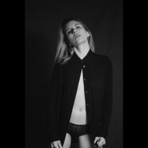 Jennifer Parkhill Instagram - —love would come
blinking fast
it would come 
it would come
it would come
  again—
.
.
.
people are always 
expecting me 
to fuck 
like a porn star
.
I only play one 
on the teevee 
some
times
.
and this time I’d wanted to. 
I’d really wanted to 
  fuck to black
	 fuck to forgetting. 
.
I was sleeping 
with women I felt 
wanted to devour me. 
perhaps they did. 
perhaps they didn’t.
perhaps I wanted 
them to. 
.
surprised to find me 
softer, sweeter, 
than what they’d 
imagined 
in a bedroom.
.
and then the fall
and the run
me running 
sans shoes 
through the night 
away from mosh 
pits of fantasy
disguised 
as love
.
my arms 
limp spaghetti
i’d only wanted 
to be tossed 
round a room
against a wall
am I ready yet
cum till I wept
.
a life in monogamy
hasn’t worked yet
I’m not taking bets
but I might be done
.
and then the gifts
they started coming
what were they buying?
what were they silencing?
never knew one
that didn’t have 
the price tag
left on
.
I had to go
.
a blizzard.
January in Texas
blanket of snow
on the Texan street
the Texan cacti
an orange tree 
.
and me alone 
with my feelings
and my friends
and my feelings
and the snow
.
and with it
I could near hear 
the radiator 
blurring steam
.
in New York
all couples
become teams
fighting the elements 
in winter
even the dead ones
rally and try again
a simple means
of survival
a heart fed
.
I could feel 
our sheets 
kicked off socks
from heat
at the foot
of a bed
our home
not my home
  anymore
.
a sleep 
like I’ve never had 
before
or again
her head 
on my
warm chest
.
busy street 
where poets 
once poet-ed 
now karaoke
and hot dogs
  yuppies
their voices 
bouncing 
off walls 
of glass
and still—
.
a place 
you could feel 
time
.
that bed
that building
that view 
of a snowblown 
city street
in morning
and—
.
gone.
.
the Texas snow.
and the feeling.
fast as they’d come.
.
and she—
like out of a sad dream
an almost nightmare
a misspent 
beautiful dream
headlights 
blaring past
screaming
love would come
blinking fast
it would come 
it would come
it would come
  again
a comet 
hurling
and for a flash
.
she was a light.
.
.
📷 @adamcolemandp 
.
.
.
#queerwriters #poetry