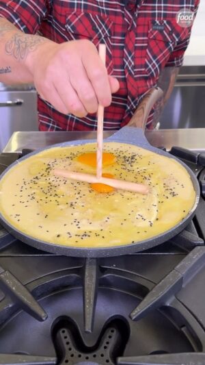 Jet Tila Instagram - Our eyes the moment @jettila cracked the eggs on this Jian Bing 🤩

Jet made this in honor of the contestants making an epic egg dish on the premiere of #24In24: Last Chef Standing!! Tune in as he judges this Sunday @ 8|7c.