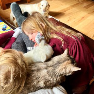 Jill Shalvis Instagram - The person under this pile of toddlers and fur babies is me. Me trying to work. Pretty sure it isn’t going to happen…🥰