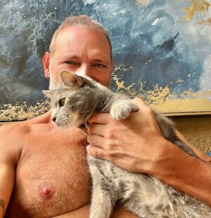 Jim Newman Instagram - It’s pet appreciation day. This is Lucas! He’s a sweet cat. He loves me to pet him until he’s had enough then he goes bipolar and bites me and kicks with his back feet. Then two minutes later he comes back for more snuggles.