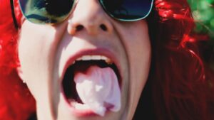 Jody Gyivicsan Instagram - I’ll chew you up and spit you out.
(Look at my gold tooth, back right 😍).

#bubblegum #findout