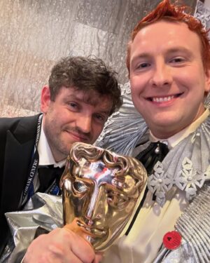 Joe Lycett Instagram - If you didn’t see this Sunday I won a BAFTA. There were two nominations, one for Best Comedy Entertainment Show and then one for Entertainment Performance. The only one I thought we had a shot at was the first, so I scribbled a speech thanking the brilliant team at LNL, then we lost it to some dickheads called Rob and Romesh.

In a clear administrative error I then won best Entertainment Performance. Those I thanked in my speech were indeed integral to my ‘performance’ - you can’t perform well unless you’re well supported - but there are a few others I missed. 

A key one is @edstambo. When I realised a little too late into my TV career that I was shit at autocue, he gave me a masterclass in it. We did hours of playing, trying to read off a screen in different ways, with silly voices and strange emphasis, trying it quiet, then loud, then mixing it all up. Those sessions and our work beyond have been immeasurably transformative.

I also owe a huge debt to fellow nominees @antanddec. A few years back they very generously agreed to meet, taking time out of production for Saturday Night Takeaway to speak to an idiot from Birmingham. Similarly @chrisevanstfi was kind enough to have a long and meandering chat giving me tons of ideas and wisdom. I use the advice all three of them gave me - how to use an earpiece, read autocue, work with a studio audience, create controlled anarchy - in every single show.

I perform way better when I look good and @krishanparmar_ and @nicolefairfield take this to extraordinary heights each week.

I am also massively supported by my real mum and dad (@momalycett, not Anne Boleyn and Henry VIII), Denise, Beth, Fitz, @lucyekane, @sawyerchris, @latenightaunties, @jennybeavandesigns, @caitlinalberybeavan, @sweetbabygriff, everyone at the @gleeclubbham and @alwaysbecomedy. 

There are a million other people who help me every day, the writers, production team, floor managers, camera team, sound, lighting, art department, and our gorgeous trainees. I’m surrounded by amazing eggs. I am a spoilt little brat. And now I’ve got a BAFTA. 

Ok. Quite enough of that. See you tomorrow for the last of the series of Late Night Lycett, 10pm, @channel4