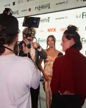 Joelle Farrow Instagram - In my head, I was playing this moment really cool. But 14 year old me was screaming inside 🥹 Swipe to the end to see me at peak “pinch me” moment. 

Here For Blood is back in the UK for round 2! Thank you @frightfestuk for having us again for our London premiere 🇬🇧