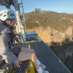 Joey Richter Instagram - 🧗🏻‍♂️WILD Australian Photos Incoming 🌄 On me & @slowpez8’s lil post-tour adventure in the #BlueMountains of NSW ⛰️, we were treated to the MOST special experience at @scenicworld_aus! During our time there we discovered firsthand that the Blue Mountains are maybe the most beautiful place in the world?? (Top notch rec from @a.j.holmes 🥇) #ScenicWorld_Aus is located in Katoomba, a mountain town that overlooks the 🤩BREATHTAKING🤩 Jamison Valley, which features the iconic #ThreeSisters 🏜️ (needless to say, it’s all fuckin stunning!). Scenic World offers 4 main attractions: Scenic Walkway 🦕 (endless rainforest paths feat. Dinosaurs — like in Slide 9), Scenic Railway 🚃 (steepest in the world!), Scenic Cableway 🚠 (ALSO steepest!), & Scenic Skyway 🚟, which sits 270 meters above the canopy below 😳

But then there #BeyondSkyway 😎 Something that I’d NEVER think I’d have the chance to do… but did!! Not only did we ride the skyway out into the center of the valley, but we got strapped in to climb ON TOP of the car 🫣 & privately enjoy the sunset w/ hot chocolate and champagne 🥂 I couldn’t fuckin’ believe it!

Now I’m prone to death-defying experiences only SLIGHTLY more than Lauren (exhibit A - her face in Slide 2)🪂 But our wonderful guide, Tony, could not make us feel safer while also encouraging us to lean out and soak in the landscape 🌅 PLUS he put up with our ONE MILLION questions about weather/how secure our rig was/the structural integrity of the cable car 🤔🤦🏻‍♂️

It was an unforgettable afternoon and I’m SO glad we worked up the courage to go for it! 🎢 Enormous thanks to Tony (pictures in Slide 10!), the whole Beyond Skyway team for being so nice to us (& also answering so many questions 🧐), & @bernsokol for being SO generous to set up this once-in-a-lifetime experience for us! 🥰
.
.
.
#explorebluemountains #australia #nswparks #skyway #daredevils #sunsetview #marriedlife💍 #coupleswhoclimbontopofcablecarsSTAYtogether