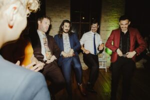 Joey Richter Instagram - ✌️🥂MY DUDES, WE GOT 2 SPECIAL OCCASIONS TODAY!! Not only is it lifelong bud @brian.Holden’s Birthday 🕺🏻🍻🎊 but it’s also @alyssakaygee & @claark’s 1st Wedding Anniversary! 👩‍❤️‍💋‍👨💍💘 As you probably know, our crew LOVES weddings 👯‍♂️👯‍♀️ but a wedding AND a birthday? Well that gets us rowdy 🐎🤠 

Such fond memories celebrating their truly gorgeous love last year in Chicago 🌆 You want proof?? Take a look at 📸pics 4-7 where we make the Hokey Pokey look fun as HELL! 🩰 

And I think it’s safe to say Brian got the best gift that year: a job w/ the Disco Guys™️🕺🏻 (employed by fellow Disco Guy, Clark) to be Wedding Covid Officers©️ Because we ALL know…The Coolest Parties, Are the Healthiest Parties 😎🤙🏼
.
.
.
#weddinganniversary #birthdayboy #covidofficers #danceyourassoff #friendparty #discoguys