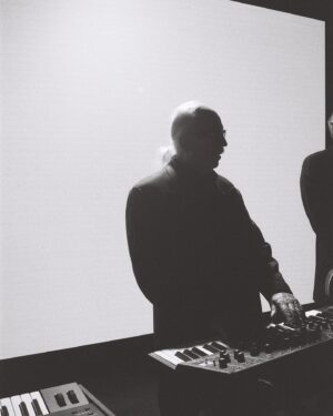 John Carpenter Instagram - John Carpenter has referred to the Lost Themes compositions as “soundtracks for the movies in your mind.” On the fourth installment in the series, those movies are noirs.

The music video for John Carpenter, Cody Carpenter and Daniel Davies’ “My Name Is Death” from Lost Themes IV: Noir is perfectly fitting; and it was shot by longtime Synth History collaborators: director Ambar Navarro (@ambarbecutie) and cinematographer Max Flick (@max_flick). You know I had to ask them about their experience working with the master of horror!

Head over to the Synth History site to check out some BTS photos by @cloudyytots, an excerpt from a conversation with John, and Three Q’s with Ambar and Max.

Catch “My Name is Death” on the big screen at @vidiots March 21st.

Lost Themes IV: Noir is out May 3rd on @sacredbones