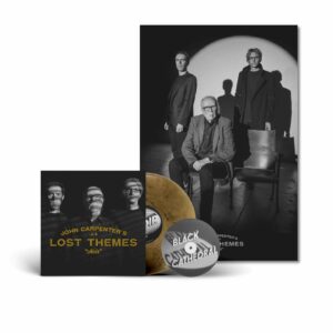 John Carpenter Instagram - Big news today! The iconic trio @johncarpenterofficial , Cody Carpenter @ludrium and @daniel_davies are back with their highly anticipated fourth installment in the Lost Themes series, Lost Themes IV: Noir. Pre-order a copy, releasing on May 3rd, on @sacredbones mail order on exclusive red splatter on clear vinyl, while supplies last! The most limited versions of the record all come with a bonus 7” “Black Cathedral” with a screen printed B side and a poster, and our mail order exclusive version comes with exclusive alternate silver foil.

It’s been a decade since John Carpenter recorded the material that would become ‘Lost Themes’, his debut album of non-film music and the opening salvo in one of Hollywood’s great second acts. Those vibrant, synth-driven songs, made in collaboration with his son Cody Carpenter and godson Daniel Davies, kickstarted a musical renaissance for the pioneering composer and director. In the years since, Carpenter, Carpenter, and Davies have released close to a dozen musical projects, including a growing library of studio albums and the scores for David Gordon Green’s trilogy of Halloween reboots. With ‘Lost Themes IV: Noir’, they’ve struck gold again, this time mining the rich history of the film noir genre for inspiration. 

John Carpenter, Cody Carpenter and Daniel Davies’s Lost Themes IV: Noir joins the 20th installment of the Sacred Bones Record Society! Enroll now to receive the album on society exclusive black and white splatter on clear vinyl, housed in a deluxe wrap-around, hand-numbered sleeve with a wax seal. The record also come with an exclusive artist curated piece of ephemera. The society exclusive version also comes with a bonus 7” and alternate silver foil. Joining these releases will be the next 2 eligible releases, each with the most limited color vinyl variant, special sleeves and artist curated ephemera. join now by purchasing Sacred Bones Society 20 on the @SacredBones website.