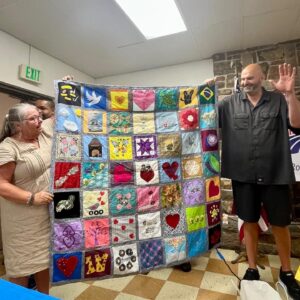 John Fetterman Instagram - Thx to all yinz for coming out to the Penn Ag Dems picnic today – especially the Bedford Co Dems, who made us this beautiful quilt🔥 and @tiedyebytuukka for the shirt☮️ 
I think we can all agree he helped me step up my wardrobe.