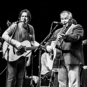 John Prine Instagram - Today’s the day! 🎄🎅

To celebrate the holidays, Bright Eyes offers their own version of John Prine’s “Christmas In Prison.” Featured within the song is a sample from “A John Prine Christmas,” released in 1993.

All proceeds from the single will benefit @sayhellointhere, which was established by the family after John’s passing to honor his kind and generous spirit. You can also nab a special edition Prine x Oberst holiday ornament. Each purchase comes with a download of the track along with a festive digital Christmas card for fans to send to their friends and family. Visit the link to learn more.

Funds generated by the release will be divided between the four major @sayhellointhere grantees for 2023: @porterscall, @tnimmigrant, @renewal_house, and @nchvorg.

📷 by @lindzbest