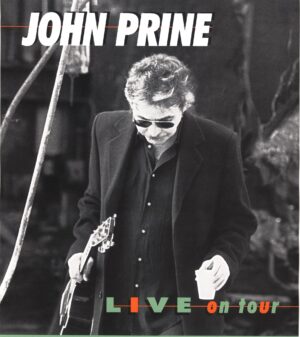 John Prine Instagram - On this day, in 1997, John released his album, "Live on Tour".

 1. Picture Show 3:55 
  2. Quit Hollerin' at Me 6:10 
  3. You Got Gold 4:56 
  4. Unwed Fathers 3:01
  5. Space Monkey 5:13
  6. The Late John Garfield Blues 4:11 
  7. Storm Windows 4:32
  8. Jesus the Missing Years 6:39
  9. Humidity Built the Snowman 4:51 
 10. Illegal Smile 4:33 
 11. Daddy's Little Pumkin 3:38
 12. Lake Marie 8:49
 13. If I Could 3:11 
 14. Stick a Needle in My Eye 3:06 
 15. You Mean So Much to Me
