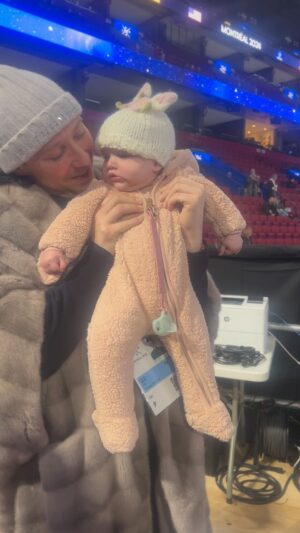 Johnny Weir Instagram - Reunited. It always feels so good to be back with J. And now with Georgie it’s even sweeter. 🥹 

Walking over to arena now as a trio is just the cutest. (Our little green eyed girl. It’s fitting she has the same eye color as me and @johnnygweir She clearly knew how much we love a matching moment) 

#worldsmtl24 #figureskating #baby #bestfriends