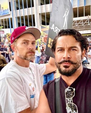 Jon Huertas Instagram - What a morning!!! Shufflin’ these #Hollywood streets with unions from across the city! The goal for us , is to shift the paradigm…to protect and even reinforce the middle class... elevate the middle class…reach back and pull people up! That’s what #leaders do…real leaders! It’s disappearing in every industry across the nation. We are marching, picketing and rallying as a call to everyone around the world to stand up for yourselves and for what is right. Something is wrong in this country when the ultra wealthy are truly cool with working class and poor people being up against the ropes and suffering. The disparity is sickening and for these corporations to continue to broadening the gaps between their CEOs/shareholders and the people that do the groundwork, we have to say enough is enough. Why not share in prosperity? So as  to bring the strength back to our country to our workers…we’re supposed to be one nation for the #people. #sagaftra #sagaftrastrong #wgastrong #fuckrobots