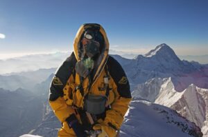 Jon Krakauer Instagram - On this day 26 years ago I shot this photo of the Australian climbing guide Mike Groom on the southeast ridge of Everest at sunrise. I shot the 2nd photo from the summit 8 hours later as cumulonimbus clouds were boiling up from the valley below. A violent storm soon engulfed the mountain, killing 8 people—including my kind, courageous, absolutely wonderful friends Doug Hansen and Andy Harris, seen in the 3rd photo posing with me during the basecamp puja 25 days before the disaster. I still grieve deeply for them. Hit the link in my profile to read more about that terrible day.