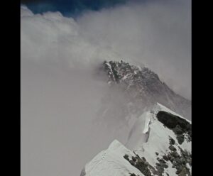Jon Krakauer Instagram - This photo of the summit ridge on Everest was shot by Nimsdai on May 22, 2019. Every year when May arrives and swarms of guided climbers queue-up like this to ascend the mountain, it triggers painful memories of my own guided ascent 28 years ago. 
 
2nd shot: On May 10, 1996, as I descended from the top of Everest, I took this photo from the crest of the Hillary Step looking down at the South Summit. (This is the same part of the summit ridge shown in Nimsdai’s photo but viewed from above instead of below.) Although I saw the cumulonimbus clouds boiling upward as they engulfed the nearby summit of Lhotse, my hypoxic brain failed to recognize that a storm was headed our way. It swept over Everest with horrific force, leading to the deaths of my guides Rob Hall and Andy Harris and my teammates Doug Hansen and Yasuko Namba. Rob’s body was found at the South Summit. Doug’s ice axe was found on the narrow ridge of snow imprinted with boot tracks in my photo. Andy’s axe was found near Rob. The bodies of Doug and Andy were never located. Yasuko’s body was recovered on the South Col where she succumbed to the storm.
 
3rd shot: Our team at Basecamp before the calamity. 
 
4th and 5th shots: A stone chorten for Yasuko, Rob, Andy, and Doug we built under the guidance of my good friend Chhongba-Dai when I returned to Everest in 1998 with Andy’s parents, Doug’s sister, and my wife to hold an intimate memorial service. 
 
6th shot: The trail to Everest Basecamp crosses a hillside studded with dozens of chortens. The majority of them memorialize Sherpas killed on Everest—a sad reminder that Sherpas do all the heavy lifting, are exposed to the greatest danger, and play an utterly crucial role on every guided Everest expedition. 125 Sherpas have been killed while working on the mountain. 
 
When “Into Thin Air” was published in 1997, I thought my book would deter novice climbers from attempting Everest but it had the opposite effect instead. The alarming, increasingly common queues like the one in the first photo are therefore partly my fault. Hit the link in my bio for more about the 1996 disaster.