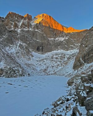 Jon Krakauer Instagram - The east face of Longs Peak at sunrise this morning. The 2nd shot is a closeup of the lake’s dark water, visible through the ice on its surface