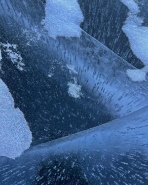 Jon Krakauer Instagram - The east face of Longs Peak at sunrise this morning. The 2nd shot is a closeup of the lake’s dark water, visible through the ice on its surface