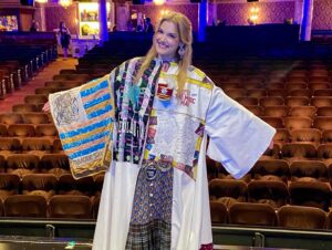 Jonalyn Saxer Instagram - All I can think to say is “wow.” On Tuesday one of my dreams came true. 
The moment I learned what the legacy robe was (many years ago), it was something I dreamed about getting. It is such a huge honor, and I feel so blessed to be a part of this incredible community. 
And this cast. Wow, do they know how to make you feel special. I’m so thrilled to be a part of this family. And all of our creatives who also showed up to celebrate this huge honor, and who lift us all up every single day. I can’t even begin to express my gratitude. 
So I’ll just be over here, still bursting into tears everytime I relive this moment. 
The legacy robe celebrates the ensemble. And if you know me, you know how much pride I have in being in the ensemble and telling the story. With this robe I carry the memories, people, experiences, and lessons learned of all my past shows that got me to this point. To each choreographer, director, and MD that gave me a chance. Each casting office that year after year has had me back, thank you. 
I just f*****g LOVE BROADWAY!
