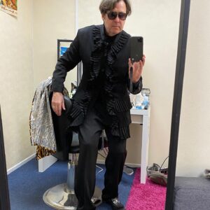 Jonathan Ross Instagram - Today’s look at the Masked Singer courtesy of Yohji Yamamoto. Not wearing this in the show - this was just to travel in. Mo Gilligan has suggested it’s the perfect look for Dracula’s funeral. Rita thinks it makes me look like Liberace. Happy with that.