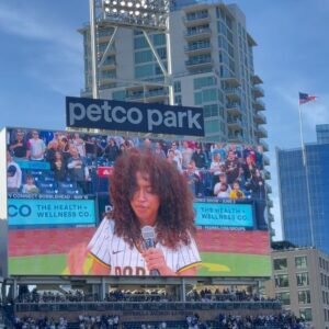 Jordyn Curet Instagram - THANK YOU @padres FOR THIS OPPORTUNITY!!! i had sm fun and loved singing for you all 🫶 thank you so much @lavocalstudio for coaching me, couldn’t have done it without you! HUGE THANK YOU TO MY AMAZING MANAGER @dbatalent ‼️
.
.
.
.
.
#jordyncuret #padres #sandiego #petcopark #sanddiegopadres #nationalanthem #mayhementertainmentpr #dbatalent