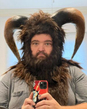 Jorge Garcia Instagram - Here’s how I made the head on my Krampus costume.
I had an old Wolfman mask where the latex on the face was starting to get crunchy. So I cut it out and kept the fur cowl figuring I’d use it for something someday. Then when this Krampus project showed up I thought it was a good place to start. I watched a horn making video on YouTube from @stiltbeaststudios. Basically you form the horns out of EVA foam. Then paint them with liquid nails to give them a nice texture. Then paint them to your liking once they dry. To attach them I made a couple of cylindrical bases which I poked through holes in the fur and contact cemented the horns to those nubs. Voila. Turned out way better than I had expected on my first try. I also got some help from my wife adding fur around the face and sewing those fur legs for me.