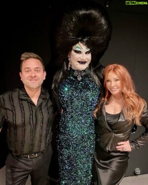 Joshua Grannell Instagram - The Midnight Mass LIVE event at the @academymuseum will be an incredible lifelong memory for me. Words cannot do justice to the extreme gratitude I have for my (official) drag mother, Cassandra Peterson aka Elvira, and the generosity of friendship she’s shown me over the years. Here we are with Midnight Mass co-host Michael Varrati just before we did the live podcast and screening of Elvira, Mistress of the Dark at the gorgeous David Geffen Theatre.

#cassandrapeterson #midnightmasspodcast #midnightmasslive #elvira #elviramistressofthedark #peacheschrist #screamqueen #ghoulgang