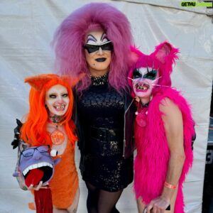 Joshua Grannell Instagram - Had an absolute blast hosting the @mosswood_meltdown_i_love_you drag competition with idol and mentor, JOHN WATERS! The drag performers were all filthy and wonderful and winners in their own right. Congratulations to @soypapichurro & @kingmeatflap for impressing John enough to win the crown! Thank you for having us, Mosswood Meltdown! And thank you to that huge crowd who stood in the heatwave staring at the sun while melting and supporting these vile performers!!! From my view, you were all blisters in the sun… 
🦩🦞🦩🦞🦩🦞
#johnwaters #mosswoodmeltdown #dragcompetition #sfdrag #bayareadrag
