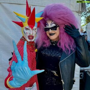 Joshua Grannell Instagram - Had an absolute blast hosting the @mosswood_meltdown_i_love_you drag competition with idol and mentor, JOHN WATERS! The drag performers were all filthy and wonderful and winners in their own right. Congratulations to @soypapichurro & @kingmeatflap for impressing John enough to win the crown! Thank you for having us, Mosswood Meltdown! And thank you to that huge crowd who stood in the heatwave staring at the sun while melting and supporting these vile performers!!! From my view, you were all blisters in the sun… 
🦩🦞🦩🦞🦩🦞
#johnwaters #mosswoodmeltdown #dragcompetition #sfdrag #bayareadrag