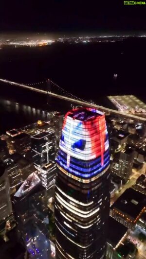 Joshua Grannell Instagram - Gorgeous drone footage by @loverly.pk of our installation, “The Tower of Christ Compels You”, on the Salesforce Tower, as well as the world’s longest rainbow laser flag shooting up Market Street in San Francisco. Happy Pride everyone! 
🏳️‍⚧️🏳️‍🌈🏳️‍⚧️🏳️‍🌈🏳️‍⚧️🏳️‍🌈
#sanfrancisco #pride #rainbow #lasers #sfpride #art #streetphotography #drone #streetsofsanfrancisco #travel #dronephotography #dronestagram #dronevideo #nightphotography #california #gay #gaypride