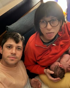 Julia Pott Instagram - 🎶There's three of us🎶 
Maximillian became the newest member of our pile last week, swanning in at a very respectable 9lbs 12 9 oz. We are obsessed with him. 

This series is entitled: "Pregnancy in reverse order" classily editing around all the acid reflux and vomiting and the fact that I gained 55lbs 🫠
