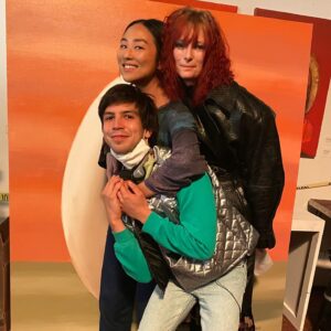 Julio Torres Instagram - Helloooo! @problemista is now available at home and in some theaters (I think) if you don’t like your home. To celebrate here’s some BTS I finally got from old phone which of course Apple made IMPOSSIBLE as they are OBSESSED with ERASING my memories 
1. Me, Greta Lee and Tilda :3
2. My (real) mom’s sketch for Ale’s lil castle
3. IMPORTANT: Tilda and @isabellarossellini meeting for the first time!!!!!
4. A birthday on set. Tbh I don’t know who’s?? But @simonsaysneha appears delighted then BACK TO BUSINESS
5. Me feeling myself in my lil armor 
6. An unhinged detail from Elizabeth’s fit
7. My sketch for Bibo 
8. Me next to finished Bibo 
9. Canon: the woman who fires Ale’s name is Sharon Johnson-Babb
10. A sign NYC gave me on a hard day on set