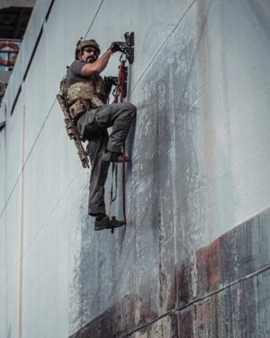 Justin Melnick Instagram - Ever dream of having giant refrigerator magnets on your hand so you can climb up metal walls…  I know I did…. The @atlasdevices pirate paddles are a game changer….. come hang!  #vbss #maritime #multicam 📷 @sunburn_studios_inc