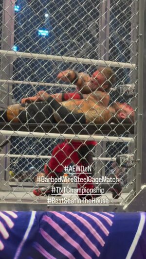 Justin Roberts Instagram - @ratedrcope doing EVERYTHING to retain his @aew TNT Championship against @malakaiblxck in a BARBED WIRE STEEL CAGE MATCH at #AEWDoubleOrNothing