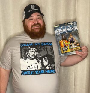 K. Trevor Wilson Instagram - This is my @therealalsnow shirt from @collarxelbow and my banned from @walmart Al Snow action figure. Al was one of my favourites to watch and I have to say it’s been really awesome corresponding. Thank you once again for all the great shirts and also Happy Birthday bud 🎂