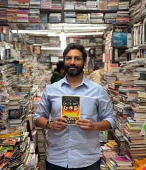 Kanan Gill Instagram - Acts of God by Kanan Gill #booksigning 

Channelling the craft of Neil Gaiman, and the humour and genius of Douglas Adams and Terry Pratchett, Kanan Gill weaves a story that will surprise readers in the best ways possible, raising the most serious of questions: What does it mean to be human?

In Kanan Gill’s wildly entertaining and moving debut novel, a Danish policeman accidentally becomes a clothing-optional leader of a worldwide group of Science Haters, a sentient piece of wall struggles with the limits of its artistic expression, and a lapel pin’s habit of always giving truthful advice causes utter chaos.

Gill puts his own spin on the long tradition of comedic science fiction, achieving a delightful alchemy of humour, imaginativeness and philosophical provocations. Blending vivid inventiveness and uproarious storytelling, with an intriguing interrogation of the very nature of existence, Acts of God marks the evolution of one of India’s finest comedic voices.

#books #kanangill #bookshop #author #fiction
