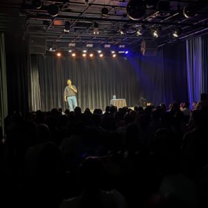 Kanan Gill Instagram - 21 shows, 19 cities, 3 illnesses, 2kg. Touring (parts of) Europe was immensely rewarding. Thank you for coming.
 . . .
“Do you ever worry about becoming a self-parody?”

The clump of moss on the rock face frowned for a minute. “In what sense? It’s your move, by the way”, it said indicating the chessboard stapled to the overhang.

“In the sense of becoming an employee of a previous version of yourself that was free.”

A passing eagle coughed pointedly at how loud we were being. I pressed myself closer to the rock face.

“Nope” said the moss, quite loudly, ignoring my shushing. “Being moss is embracing the plurality of existence, in the sense that there is no singular moss, there are outlines until there is mossing, and that space in which there is moss-ness, is moss. Dude seriously it’s your move.”

The chessboard has no pieces, since we were high up an infinite rock face and it was stapled sideways.

“So you’re talking about being as a process—“

“—A mossess”, corrected the moss.

“But you can still take a sliding window of the continuous change of self and call it who you used to be—“

“—what is this really about?” Interrupted the moss, finally lowering it voice and putting away its Nokia Ngage.

“That I’m worried lasting growth is impossible and decay is inevitable. I keep climbing from epiphany to epiphany, never further off the ground; fingers clasped around realisation, finding the odd abscess of wisdom to rest in. I’ve moved so much, but I’m still here.”

A shower of embarrassed rocks fell past from heights unknown to depths infinite, mumbling apologies. I wept bitterly.

“Ah silly” said the moss ruffling my hair. “There’s nowhere to reach. The path isn’t the climb, it’s the climber. You don’t scale these heights. You hang on till you fall off one day.”

A shuddering relief left my lips. “That’s it?”

“That’s it, smiled the moss. “Now, do you want to play your turn?”

“Sure. Knight to E3!”

“Dude this is Ludo.”